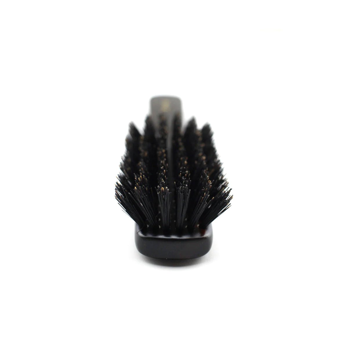 Close-up front view of a Japanese Kanaya hair brush showcasing densely packed black natural bristles arranged in a round pattern, ideal for detangling and smoothing hair.