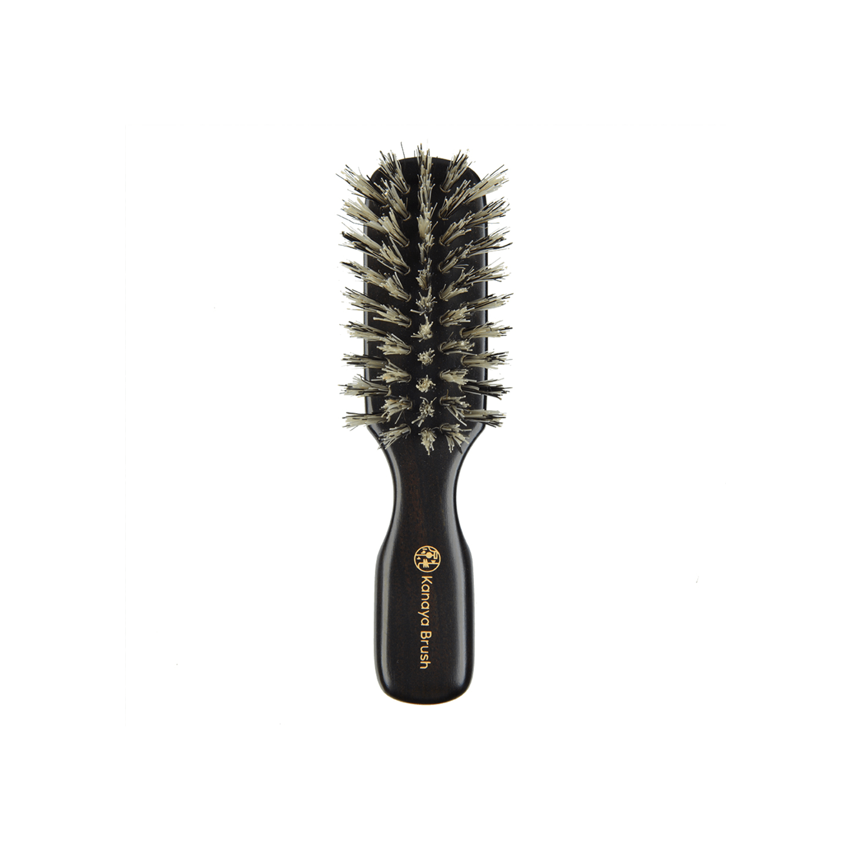 A compact travel-sized natural bristle hairbrush from Kanaya Brush with a dark wooden handle engraved in gold. The soft boar bristles are densely packed in a rounded rectangular shape, designed to gently detangle hair, add shine, and distribute natural oils while on the go. Ideal for maintaining hair health during travel.