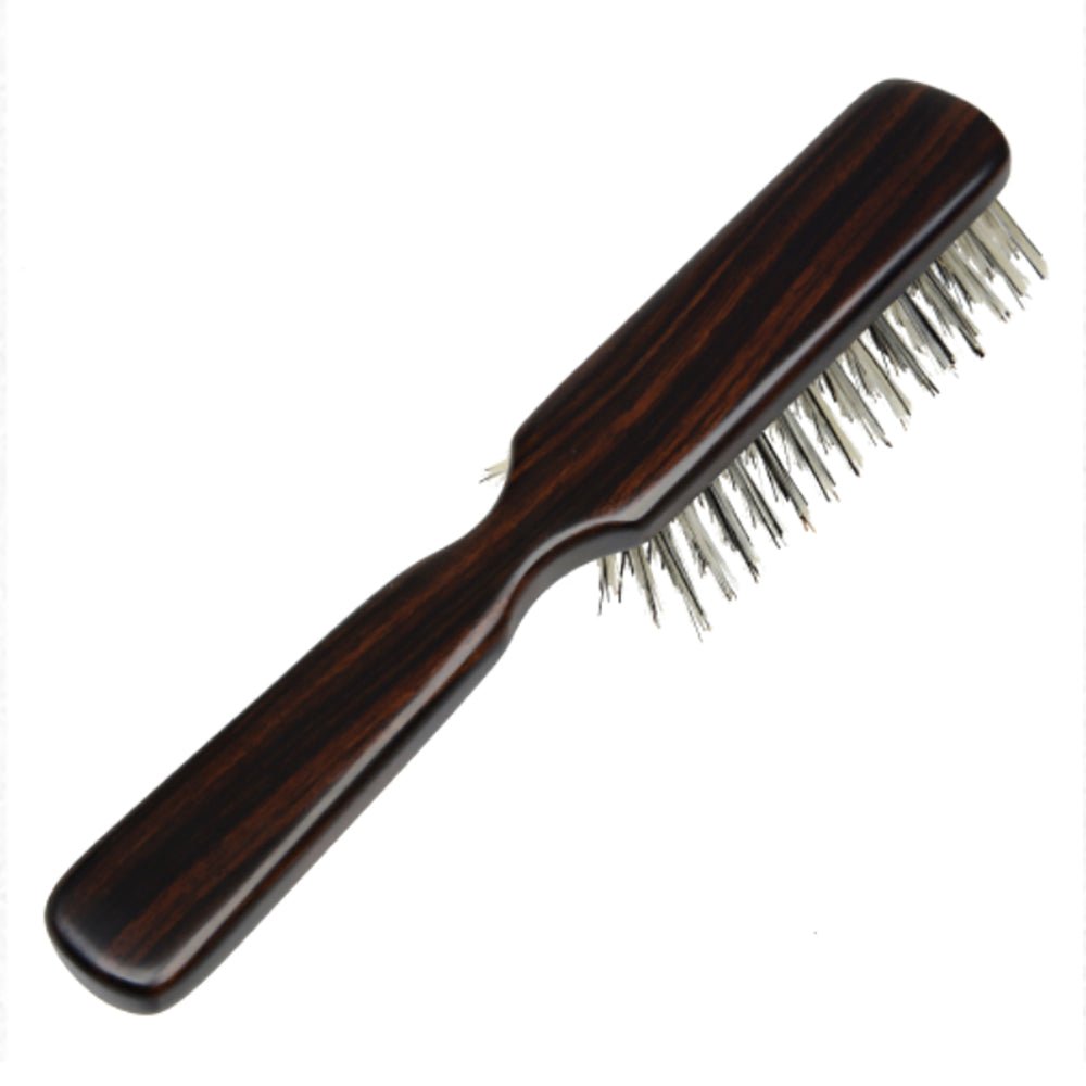 Angled side view of the Kanaya flat natural bristle hair brush, featuring polished dark wood and densely packed soft bristles for gentle scalp care.