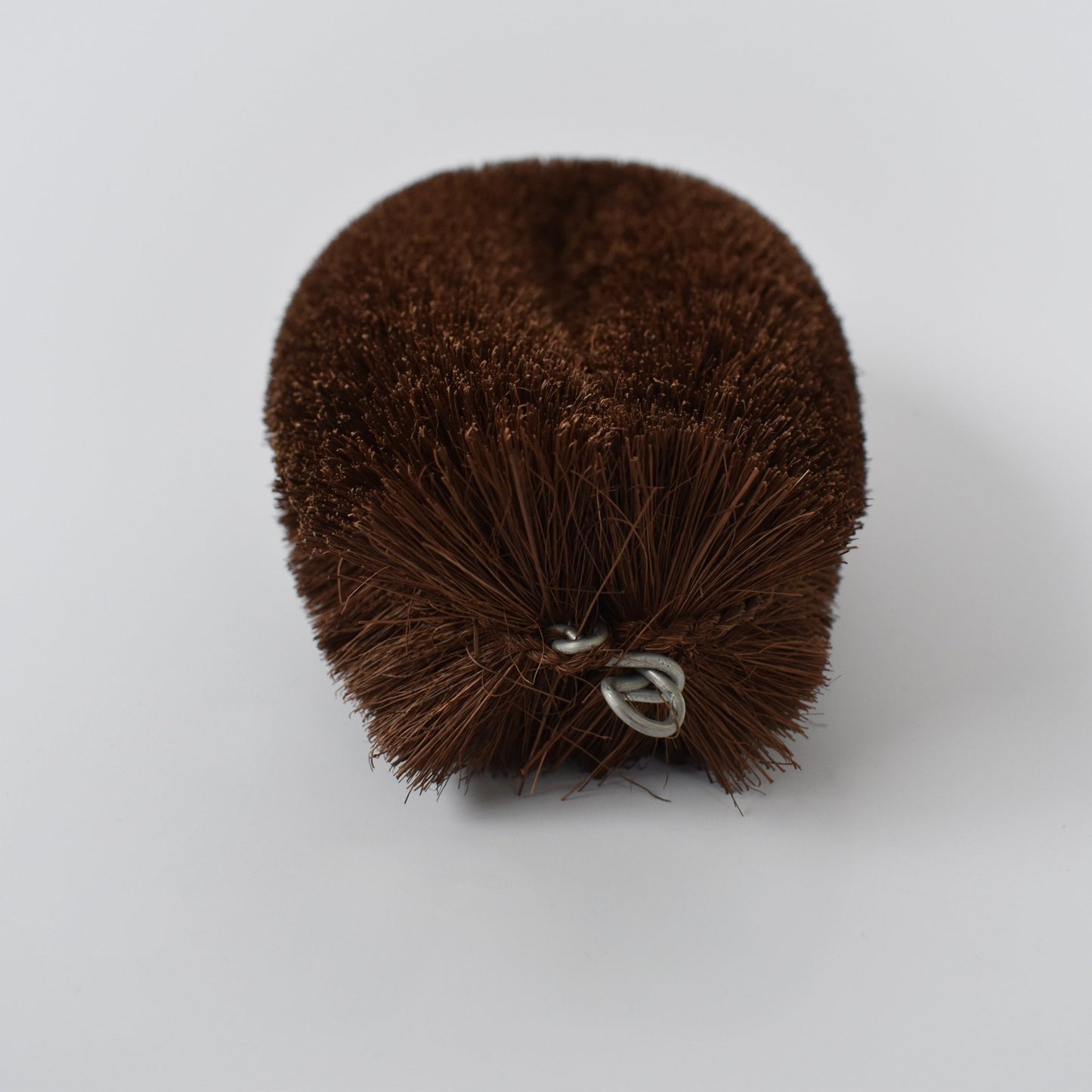 Close-up of the extra-large Shuro Tawashi scrubber showing wire loop and bristle texture.