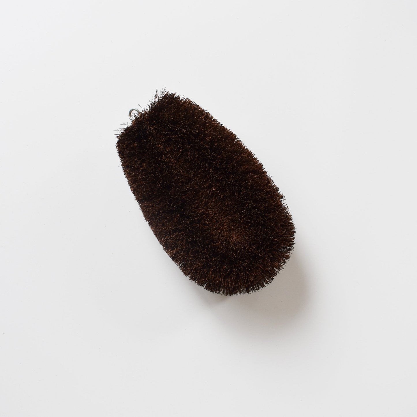 Flatlay of the extra-large Shuro Tawashi scrubber with coconut fiber bristles against a white background.