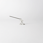 Pewter frog-shaped incense holder from Chōjū-Giga scrolls, holding a lit incense stick in a dynamic pose on a clean white background.