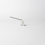 Pewter frog-shaped incense holder from Chōjū-Giga scrolls, holding a lit incense stick in a dynamic pose on a clean white background.