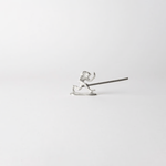 Chōjū-giga monkey-shaped incense holder made from cast tin, holding a lit incense stick in a minimalist white setting – inspired by Japan’s oldest picture scroll.