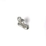 Back view of a silver monkey-shaped incense holder inspired by Chōjū-giga, featuring a straw hat and playful pose on a smooth base.