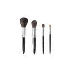 Chikuhodo Japanese makeup brush set with four handcrafted brushes in varying sizes for face and eye application, featuring soft bristles, sleek black handles, and silver ferrules.