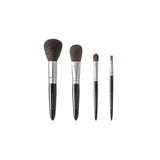 Chikuhodo Japanese makeup brush set with four handcrafted brushes in varying sizes for face and eye application, featuring soft bristles, sleek black handles, and silver ferrules.
