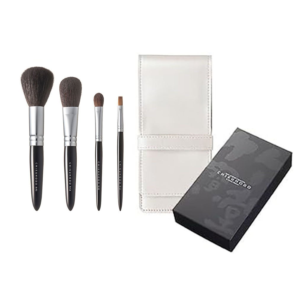 Japanese Chikuhodo makeup brush set with four brushes, elegant white leather travel case, and black gift box — professional-grade tools for flawless application.