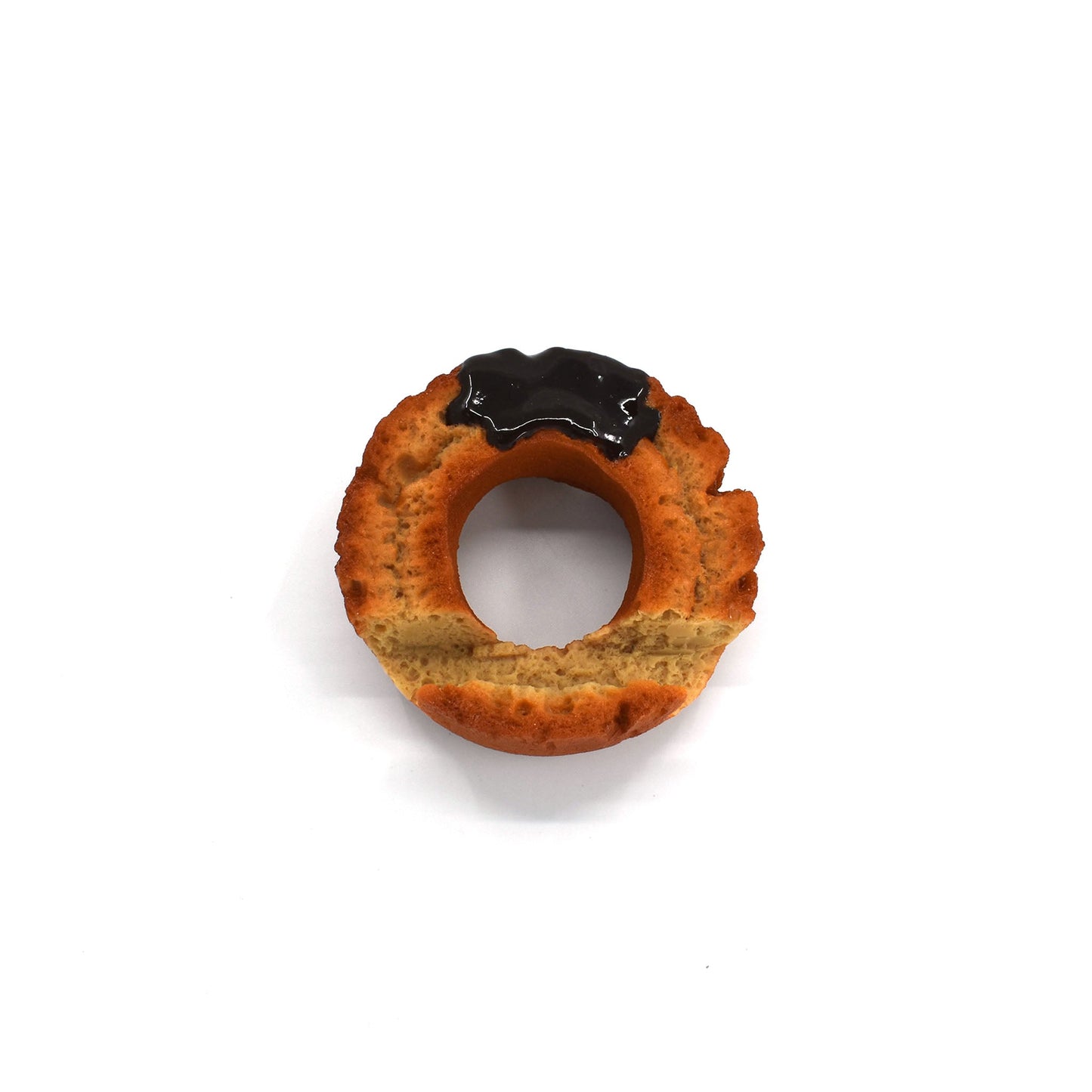 Hyperrealistic chocolate-glazed donut phone holder with a textured golden-brown finish and glossy topping, styled to look like a freshly baked old-fashioned donut.