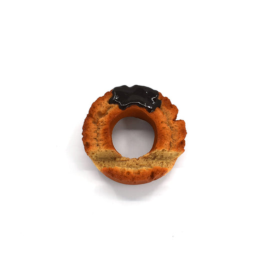 Hyperrealistic chocolate-glazed donut phone holder with a textured golden-brown finish and glossy topping, styled to look like a freshly baked old-fashioned donut.
