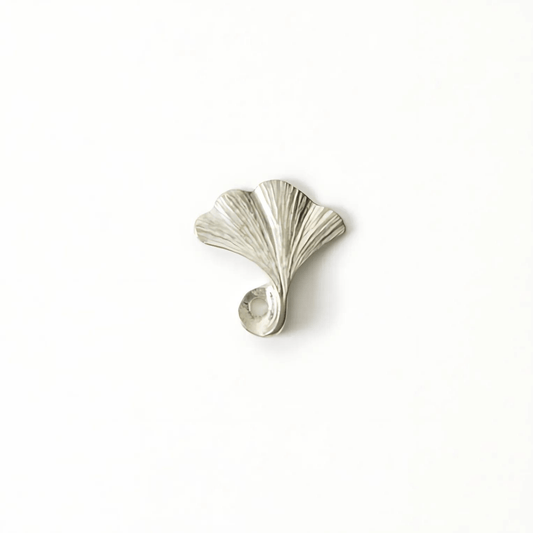 lver pewter incense holder shaped like a ginkgo leaf, displayed on a white background