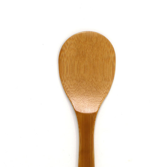 Close-up of a handcrafted Japanese bamboo rice paddle (shamoji) with a smooth finish, designed for non-stick cookware and perfect for serving or mixing steamed rice.