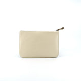 Ivory leather zip pouch with smooth finish on white background, perfect for storing daily essentials, makeup, or tech accessories