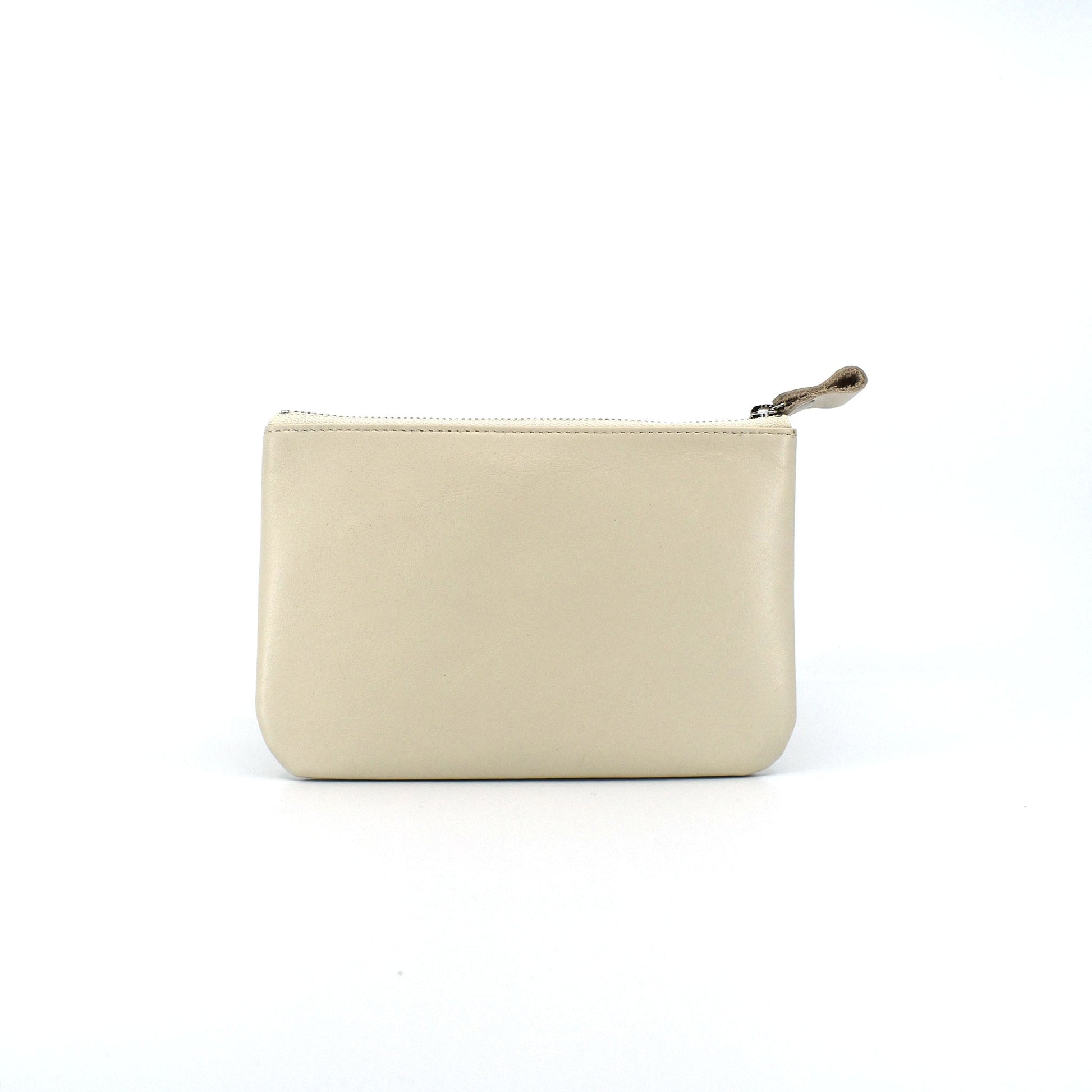Ivory leather zip pouch with smooth finish on white background, perfect for storing daily essentials, makeup, or tech accessories