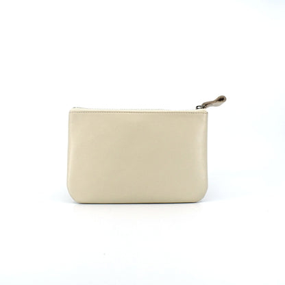 Ivory leather zip pouch with smooth finish on white background, perfect for storing daily essentials, makeup, or tech accessories