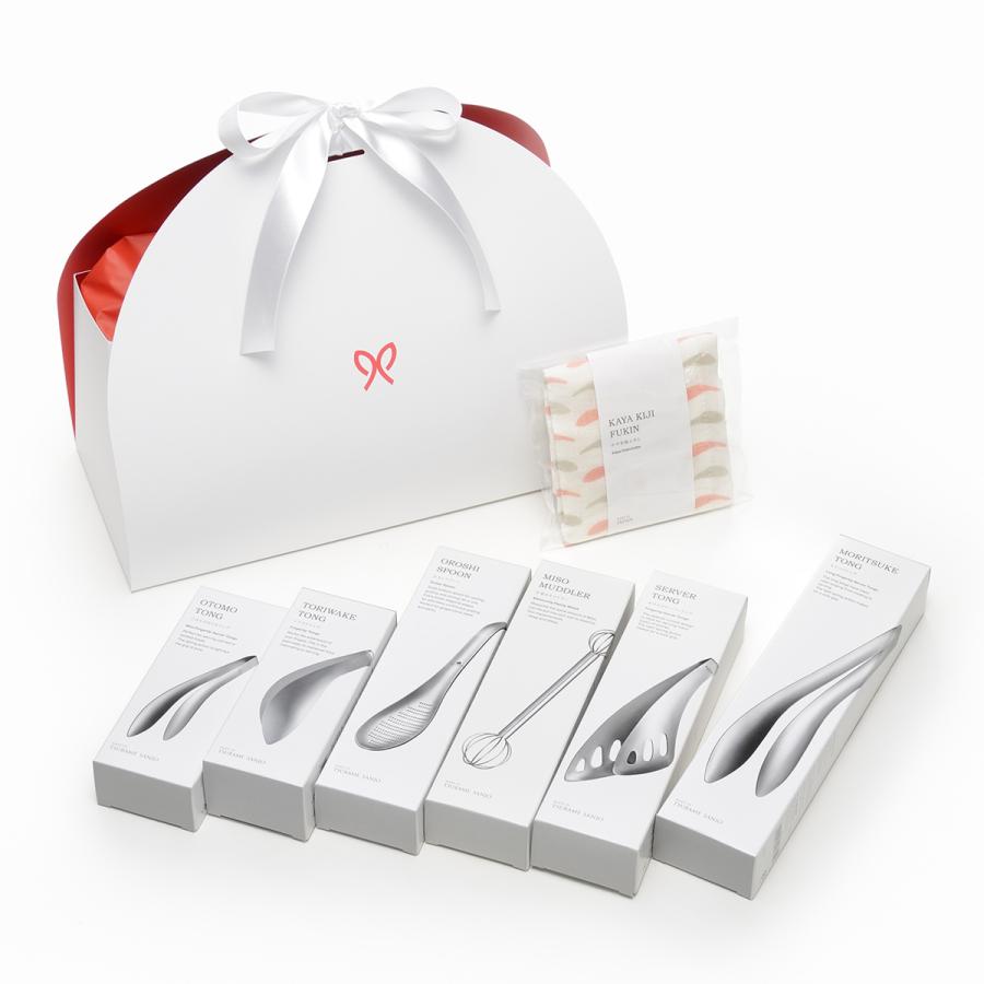 Japanese Precision Kitchen Set, the gift box beside the six stainless tools in their individual boxes and the wrapped cloth.