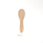 Natural wood replacement base for Kanaya lint brushes, handcrafted in Japan with a smooth finish and hanging loop, designed for easy bristle refitting.
