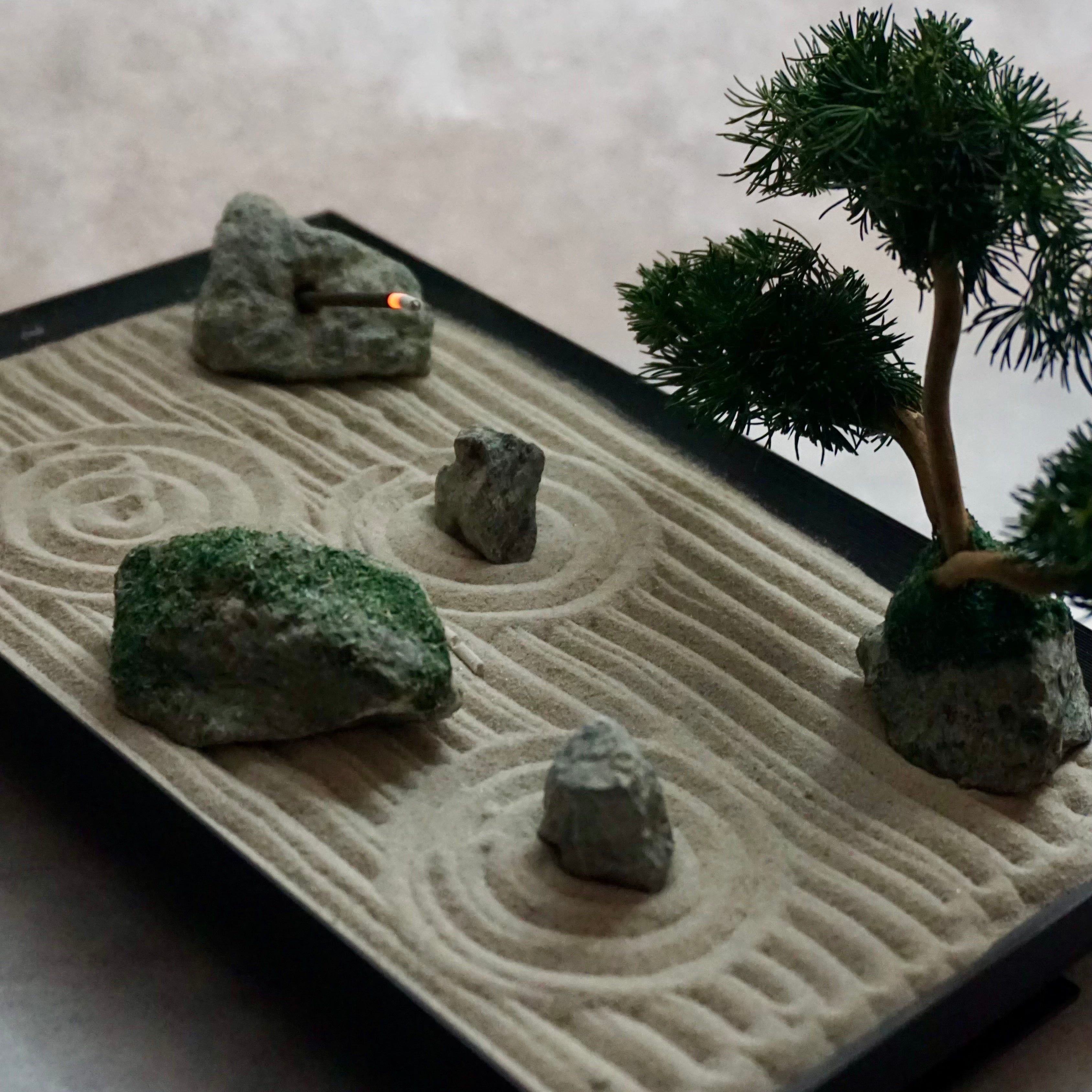 Mini Karesansui Zen Garden Incense Holder with sand patterns, stones, and bonsai tree.