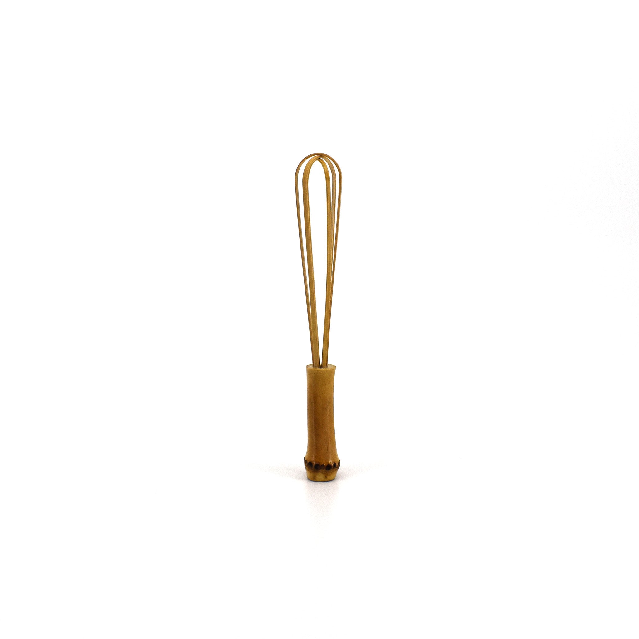A small handcrafted bamboo whisk with a natural finish, perfect for delicate kitchen tasks or as a decorative traditional tool.