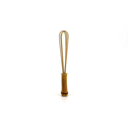 A small handcrafted bamboo whisk with a natural finish, perfect for delicate kitchen tasks or as a decorative traditional tool.