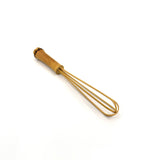 Angled view of a handcrafted mini bamboo whisk with a natural bamboo handle, designed in Japan for precise stirring, blending, and matcha preparation.