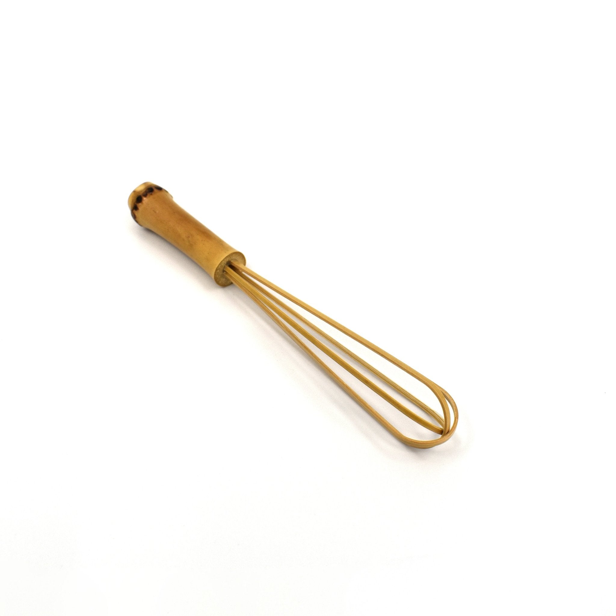 Angled view of a handcrafted mini bamboo whisk with a natural bamboo handle, designed in Japan for precise stirring, blending, and matcha preparation.