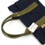 Angled flat lay of Japanese mini denim tote bag with olive webbing handles, silver rivets, and visible Thread Line Tokyo hangtag
