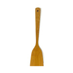 Top-down view of the artisan bamboo cooking turner showing the flat back side of the spatula with a smooth, natural grain finish and a rounded hanging hole at the end of the handle for easy storage.