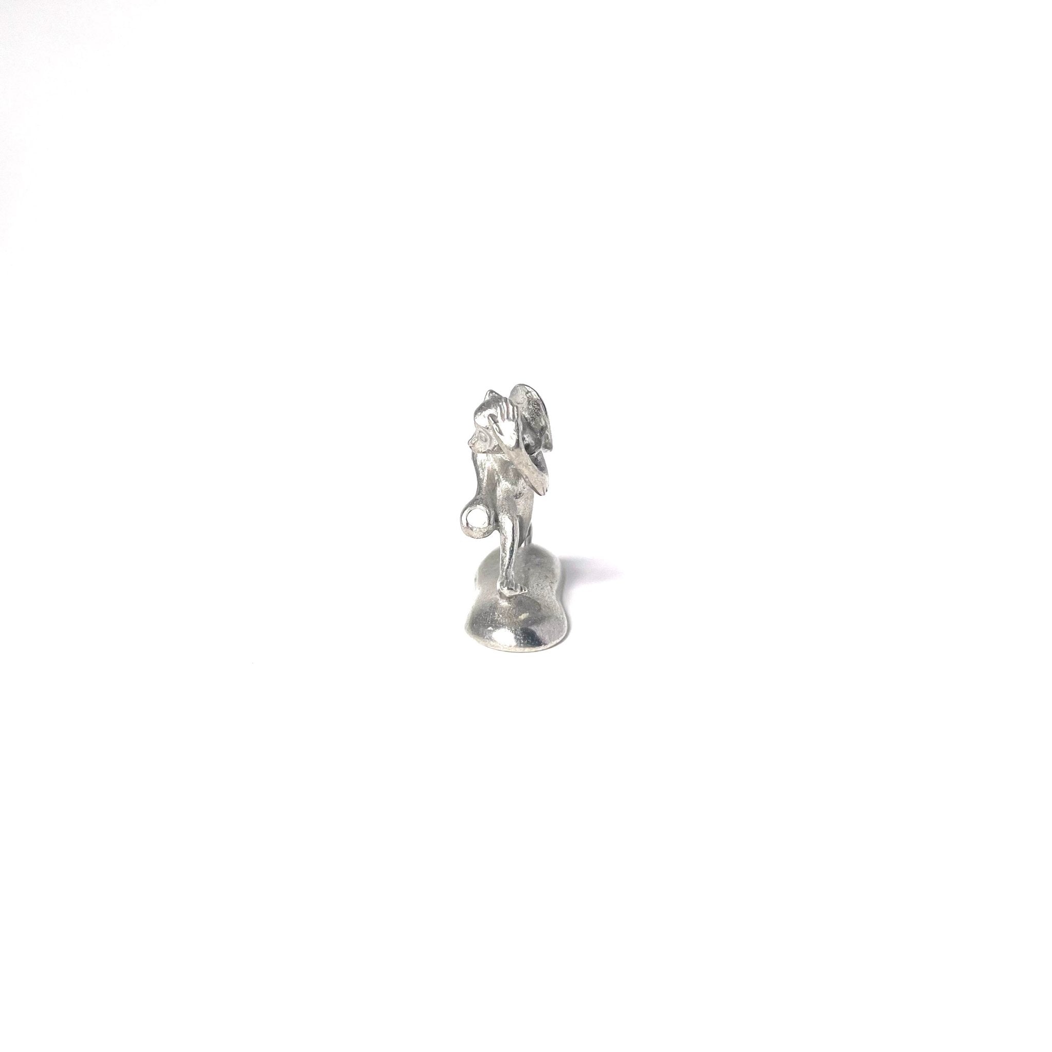 Chōjū-giga rabbit-shaped incense holder made from cast tin, holding a drum in a charming pose—based on the iconic Japanese animal scroll artwork.