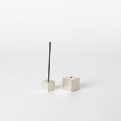 A minimalist silver cube incense holder with a clean, modern design, featuring one cube holding a thin incense stick while the other cube is displayed beside it on a white background, showcasing Japanese craftsmanship.