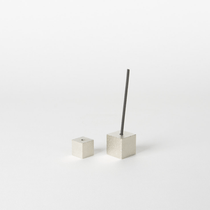 Silver cube incense holder set on a white background, with one cube holding a vertical incense stick and the other placed beside it, highlighting minimalist Japanese home decor aesthetics.