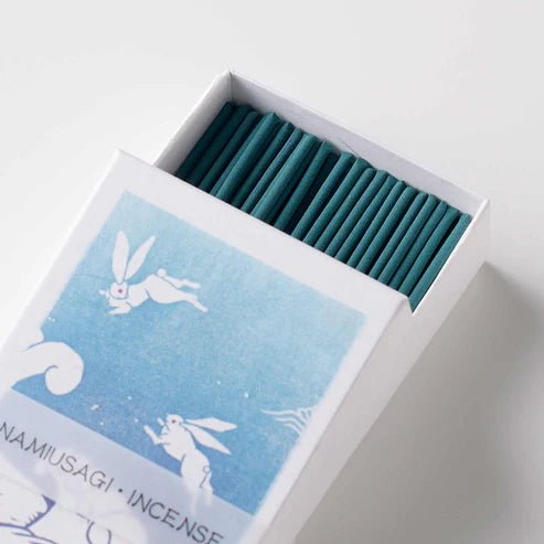 Open Hanga Wave incense box showing neatly arranged teal incense sticks and rabbit-themed blue label