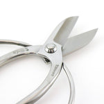 Hidehisa stainless steel floral shears with blades open, showcasing the sharp cutting edges and engraved Japanese characters on the smooth, ergonomic handles.
