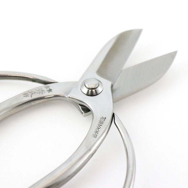 Hidehisa stainless steel floral shears with blades open, showcasing the sharp cutting edges and engraved Japanese characters on the smooth, ergonomic handles.