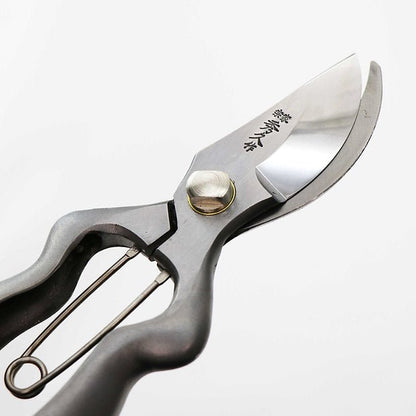 lade detail of Hidehisa stainless garden pruners with engraved Japanese kanji. 