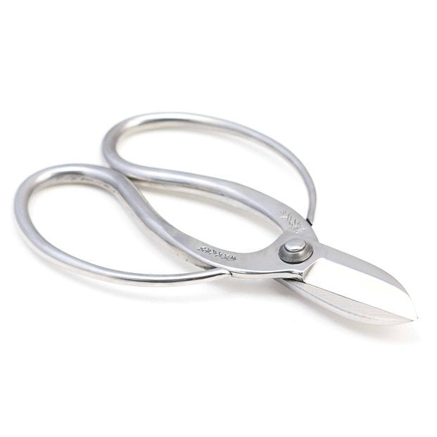 Hidehisa stainless steel ikebana shears with a polished finish, showcasing wide looped handles and sharp, short blades designed for precise floral trimming.