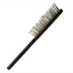 Long-handle Japanese hair brush with densely packed white natural bristles and a slim, dark wood grip designed for gentle, effective detangling.