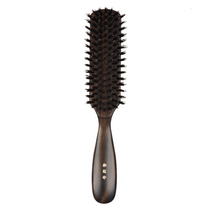 Front view of the Kanaya wild boar bristle hair brush with firm bristles, featuring a polished dark wood handle and gold-stamped Japanese lettering.