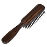 Back view of a Kanaya long-handle hairbrush featuring a polished wooden finish and densely packed wild boar bristles.