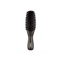 Front view of the Kanaya wild boar bristle travel hairbrush. Features a compact, oval head with firm black bristles and a glossy dark wood handle engraved with gold Kanaya lettering.