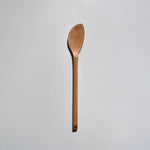 Sakura wood soup spatula with long handle and smooth carved spoon shape on a white background