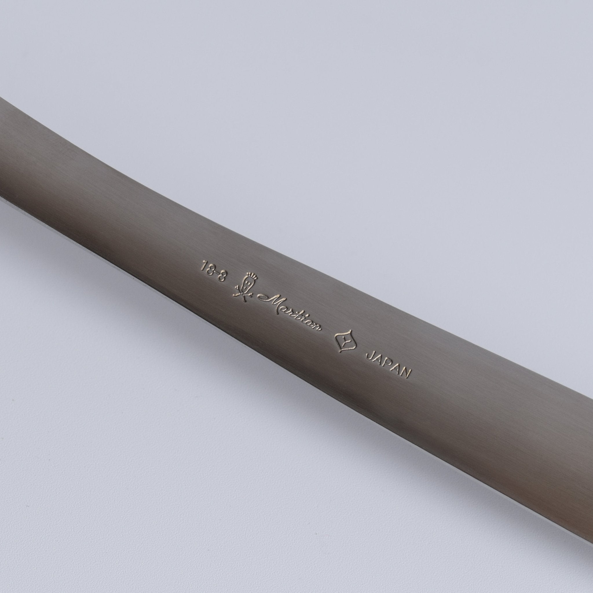 Close-up of Sori Yanagi Stainless Steel Ladle handle stamped with Japan mark — authentic Japanese kitchenware.