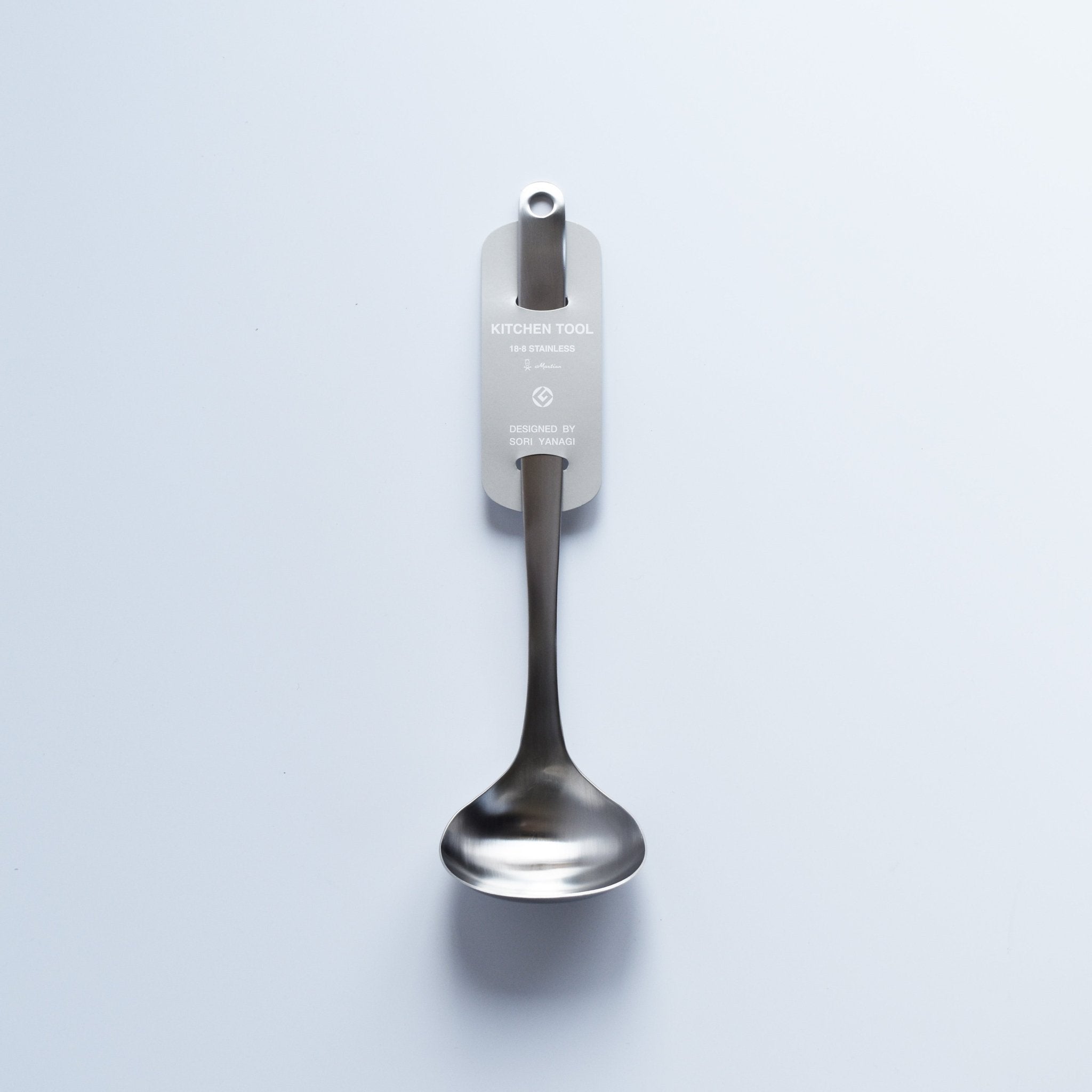 Sori Yanagi Stainless Steel Ladle with original branded tag attached, displayed on light background.