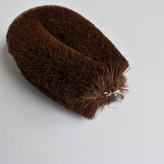 Extra-large Shuro Tawashi scrubber made from natural palm fibers, angled view