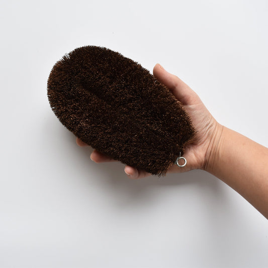 Extra-large Shuro Tawashi scrubber shown in hand to display size and grip