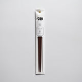Plum wood chopsticks in minimalist white packaging with floral illustration