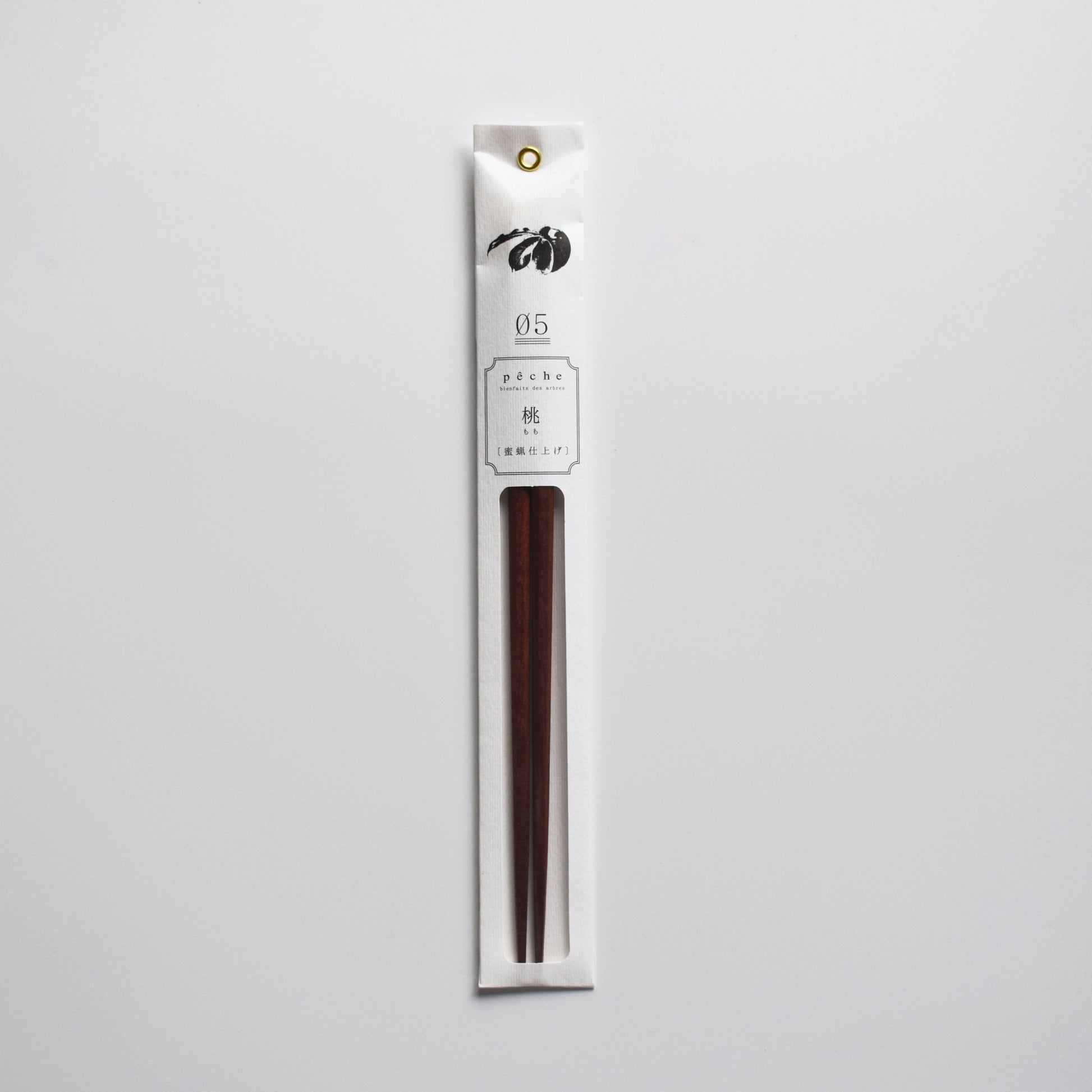 Plum wood chopsticks in minimalist white packaging with floral illustration