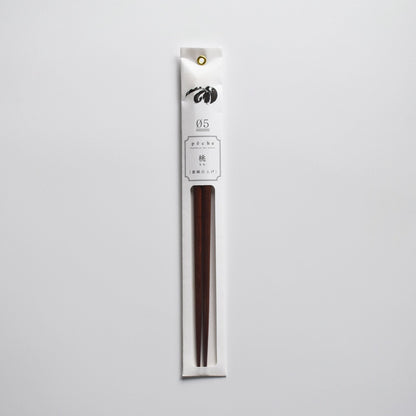 Plum wood chopsticks in minimalist white packaging with floral illustration