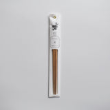 Single pack of Tetoca wooden chopsticks in the Kuri Chestnut wood variant, displayed in original Japanese packaging on a light background.
