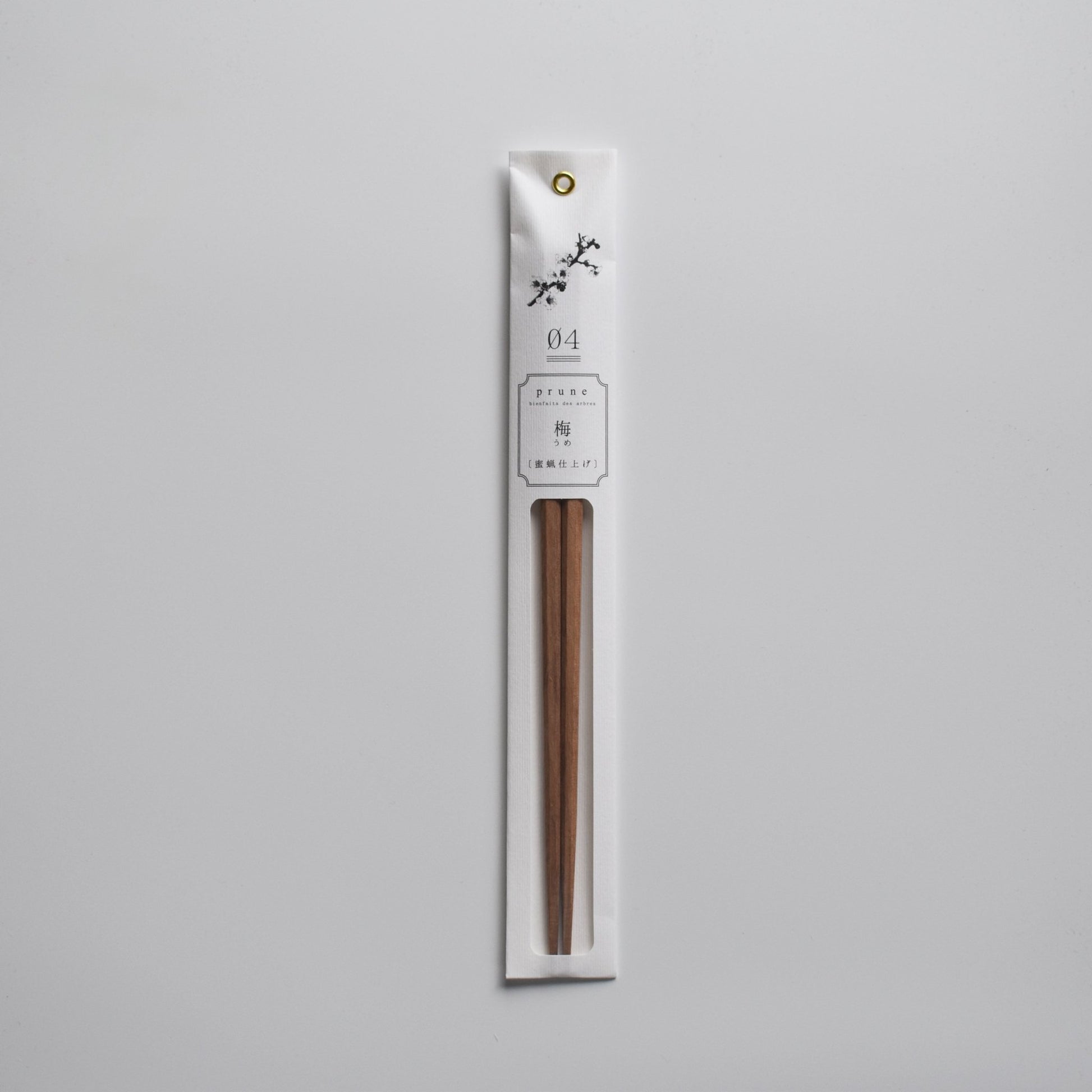 Minimalist packaged chopsticks made from Japanese ume (plum) wood with a delicate floral label design